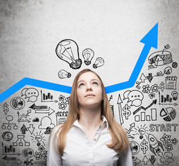 Business lady is looking for new business ideas. Blue growing arrow as a concept of successful...