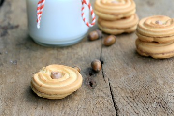 tasty cream cookies and milk