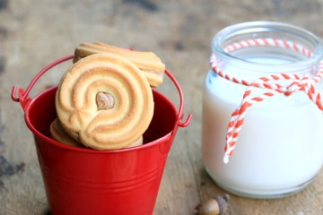 tasty cream cookies and milk