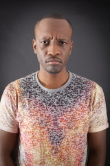 Fototapeta premium Handsome man doing different expressions in different sets of clothes: angry