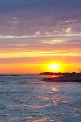 Fototapeta premium Tranquil sea sunset on a background the cloudy sky