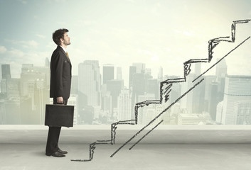 Business man climbing up on hand drawn staircase concept