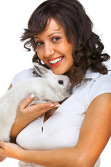 Young woman hugging rabbit