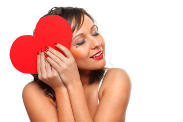 Young woman holding red paper heart