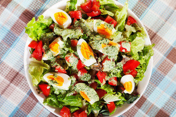 Summer salad with tomatos and boiled eggs