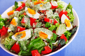Summer salad with tomatos and boiled eggs