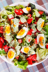 Summer salad with tomatos and boiled eggs