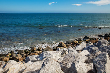 Fototapeta na wymiar Stones along the rugged coast near Malibu, CA
