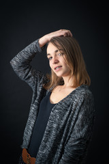 Beautiful woman doing different expressions in different sets of clothes: posing