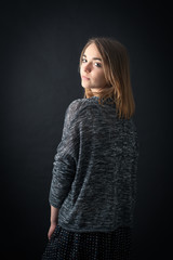 Beautiful woman doing different expressions in different sets of clothes: posing