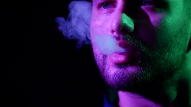 man lips with smoke cloud. Slow motion. silhouette