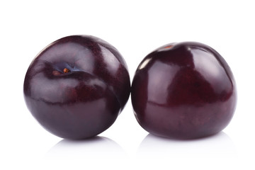 plums isolated on white