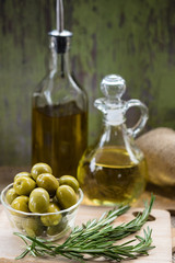Green Olives with Bottles of Olive Oil