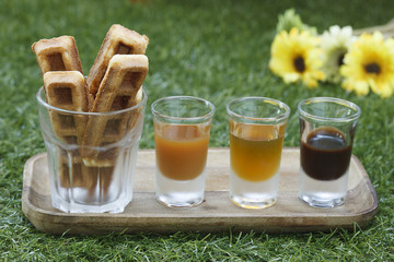 Wallfes with syrup on grass background