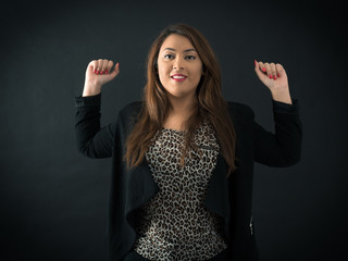 Beautiful woman doing different expressions in different sets of clothes: arms raised