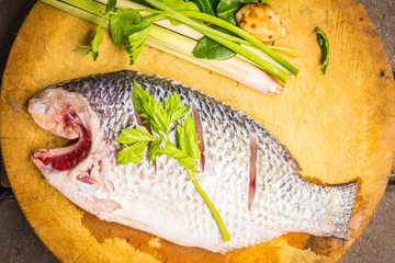 Place the fish on a cutting board