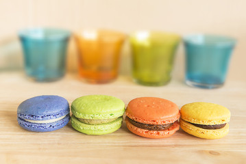 Macarons on wooden and glass-colorful.