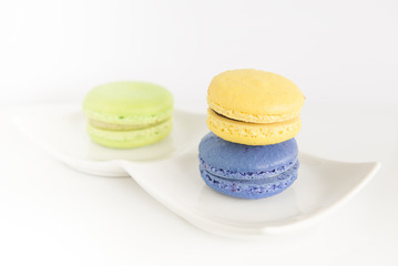 Macarons on white background.