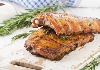 BBQ ribs  on a wooden cutting board.