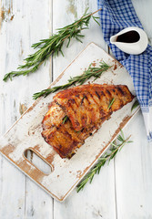 BBQ ribs  on a wooden cutting board.