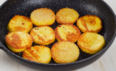 Roasted Cheese on  black pan.