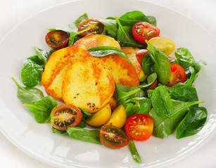 Roasted Cheese and tomato salad on plate.