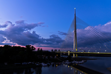 Fototapeta na wymiar Cable bridge at twilight over Sava river near Ada island