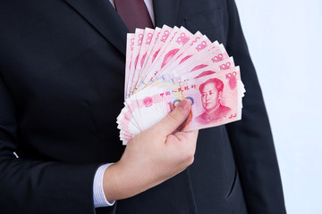 Holding Yuan or RMB, Chinese Currency