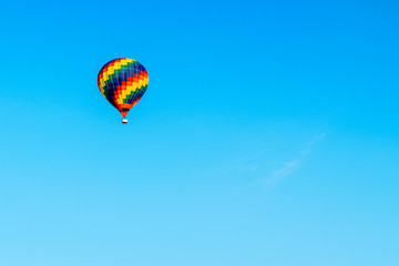 Fototapeta na wymiar Hot Air Balloon soaring in the sky.