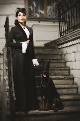 Naklejka premium Young woman in ancient costume with dog (ancient ver)