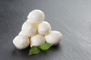 mozzarella balls on slate board