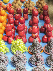 Market place selling of fruits arraneged in pattern