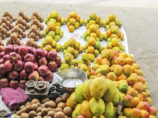 Market place selling of fruits arraneged in pattern