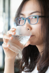 Asia woman drink water.