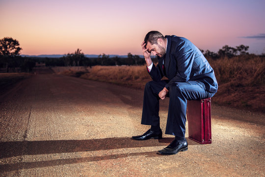 Concept: A Frustrated Business Man Is Leaving The Corporate Lifestyle And Chasing Freedom In The Outback Of Queensland, Australia. Cinematic Portrait Style.