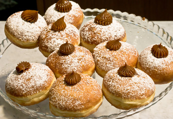Fresh donuts with chocolate in a market bakery during the Jewish holiday of Hanukkah.