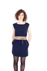 Beautiful Hispanic woman doing different expressions in different sets of clothes: hands in pockets