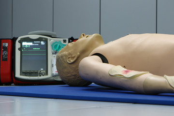 Fototapeta na wymiar Defibrillator and CPR dummy doll