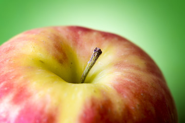 macro apple on green background
