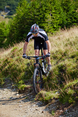 Fototapeta premium Mountain biker on trails
