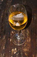 Glass of wine on a wooden table