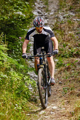 Fototapeta premium Mountain biker on trails