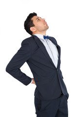 Handsome man doing different expressions in different sets of clothes: backache