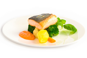 salmon fillet with potato on the white plate 
