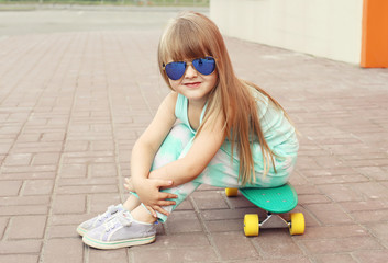 Fashion kid concept - stylish little girl child wearing a t-shir