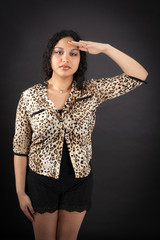 Beautiful woman doing different expressions in different sets of clothes: at attention