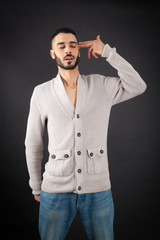 Obraz premium Handsome man doing different expressions in different sets of clothes: suicide
