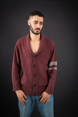 Handsome man doing different expressions in different sets of clothes: sad