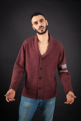 Handsome man doing different expressions in different sets of clothes: surprise