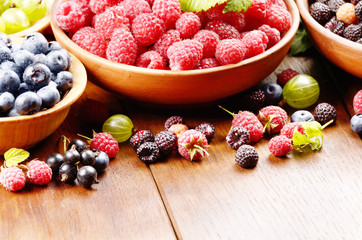 Wooden bowls with organic berries